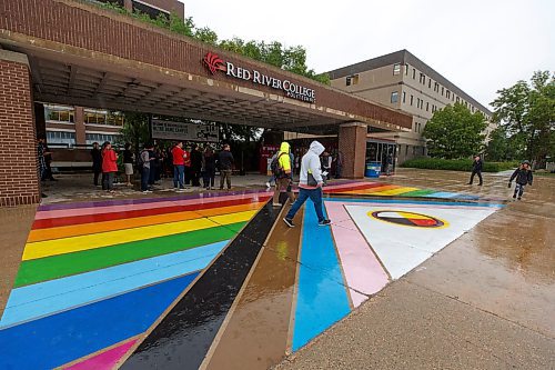 MIKE DEAL / WINNIPEG FREE PRESS
On the first day of classes for the fall semester, RRC Polytech unveiled its first Rainbow Walkway at the main entrance of its Notre Dame Campus. The Rainbow Walkway features a 14 by 7-metre (approximately 45 by 22.5-feet) painting of a new Pride design that includes representation for all 2SLGBTQIA+ (Two-Spirit, Lesbian, Gay, Bisexual, Transgender, Queer and/or Questioning, Intersex and Asexual) community members. Similar paintings will welcome guests at the College&#x2019;s Exchange District Campus and Portage La Prairie Campus. 
220829 - Monday, August 29, 2022.