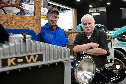 BROOK JONES / WINNIPEG FREE PRESS
World of Wheels publicist Shelley Ostrove (right) and Gord Cooper from Ocean Hauling and Hotshot Ltd., stand beside an antique Kenworth truck during Piston Ring's 46th annual World of Wheels at the RBC Convention Centre in Winnipeg, Man., Saturday, March 25, 2023. 