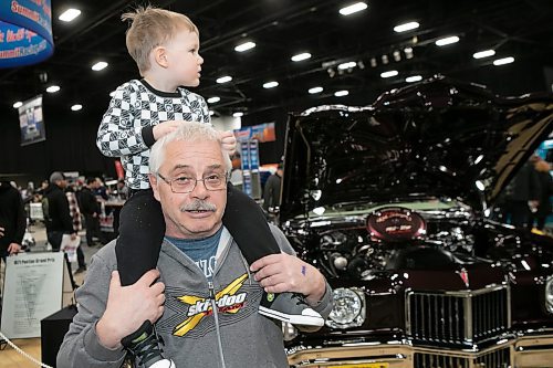 BROOK JONES / WINNIPEG FREE PRESS
Jim Therrien and his three-year-old grandson, Austin Young, check out the vehicles while attending Piston Ring's 46th annual World of Wheels at the RBC Convention Centre in Winnipeg, Man., Saturday, March 25, 2023. 