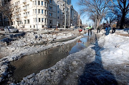 JOHN WOODS / WINNIPEG FREE PRESS
Cyclist Hillary Rosentreter, left, and other cyclists clear an Assiniboine Avenue bike path of ice  Sunday, March 26, 2023. 

Re: Malak