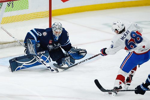 JOHN WOODS / WINNIPEG FREE PRESS
Manitoba Moose goaltender Arvid Holm (32) saves the shot by Laval Rocket&#x2019;s Riley McKay (68) during first period AHL action in Winnipeg on Sunday, March 26, 2023.

Reporter: ?