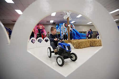 Five-year-old Mason Rose rides a pedal tractor during the opening day of the Royal Manitoba Winter Fair at The Keystone Centre on Monday. (Tim Smith/The Brandon Sun)
