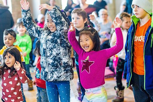 MIKAELA MACKENZIE / WINNIPEG FREE PRESS

Zerene (nine, left) and Riane (seven) Reyes do a warm-up whole body shake with performer Sarah Teakle at the Festival of Fools at The Forks in Winnipeg on Monday, March 27, 2023. Standup.

Winnipeg Free Press 2023.