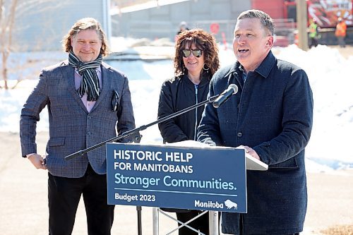 27032023
City of Brandon Mayor Jeff Fawcett and Tanya LaBuick, President of the Brandon Chamber of Commerce, listen as Transportation and Infrastructure Minister Doyle Piwniuk makes an infrastructure announcement on 17th Street North in front of the ongoing 18th Street Bridge construction on Monday. (Tim Smith/The Brandon Sun)