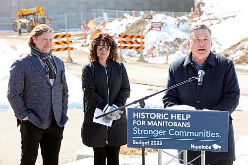 27032023
City of Brandon Mayor Jeff Fawcett and Tanya LaBuick, President of the Brandon Chamber of Commerce, listen as Transportation and Infrastructure Minister Doyle Piwniuk makes an infrastructure announcement on 17th Street North in front of the ongoing 18th Street Bridge construction on Monday. (Tim Smith/The Brandon Sun)