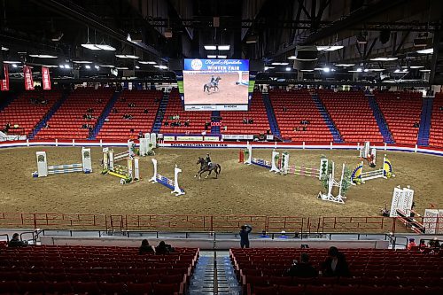 A competitor and their horse prepare to leap over an obstacle in the Hunter Jumper show Tuesday morning during the Royal Manitoba Winter Fair at the Keystone Centre. (Tim Smith/The Brandon Sun)