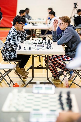 MIKAELA MACKENZIE / WINNIPEG FREE PRESS

Samuel Daya, gr. 11 student and leader of the Sisler chess club (left), and Yaroslav Kolesnykov, gr. 10 student from the Ukraine now attending Kelvin, play against each other in the Manitoba high school chess championship at Sisler High School in Winnipeg on Tuesday, March 28, 2023. Over 60 students participated in the event. For Tyler story.

Winnipeg Free Press 2023.