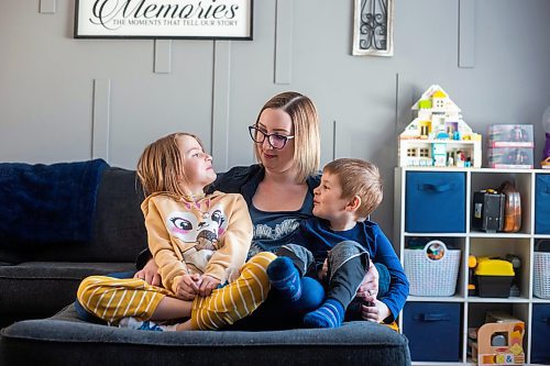 MIKAELA MACKENZIE / WINNIPEG FREE PRESS

Kaitlin Bialek and her kids, Emma (seven) and Emmett (four), pose for a photo in their home in Winnipeg on Tuesday, March 28, 2023. The Bialeks were once again unable to get spots in swimming lessons, and city data shows there are 11,604 wait list entries for City of Winnipeg swimming lessons and 967 learn to swim activities with wait lists. For Joyanne story.

Winnipeg Free Press 2023.