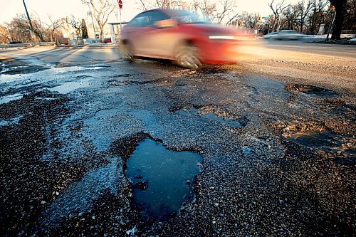 JOHN WOODS / WINNIPEG FREE PRESS
Car drivers avoid potholes on Academy at Wellington in Winnipeg Tuesday, March 28, 2023. 

Reporter: ?