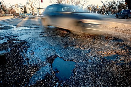 JOHN WOODS / WINNIPEG FREE PRESS
Car drivers avoid potholes on Academy at Wellington in Winnipeg Tuesday, March 28, 2023. 

Reporter: ?