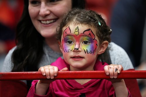 Gemma Lesage, 2, watches the WoofJocks Canine All Stars' perform along with her mother Ashley during the Royal Manitoba Winter Fair at Westoba Place on Wednesday. (Tim Smith/The Brandon Sun)
