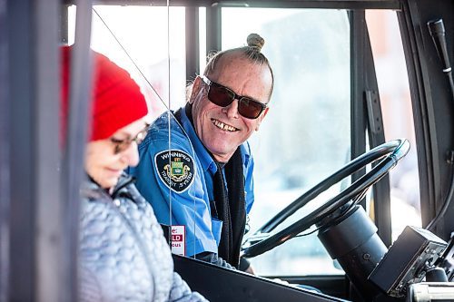 MIKAELA MACKENZIE / WINNIPEG FREE PRESS

Transit operator Joseph Fullmer greets riders on the 18 bus at Garden City Shopping Centre bus loop in Winnipeg on Thursday, March 23, 2023. For Dave story.

Winnipeg Free Press 2023.