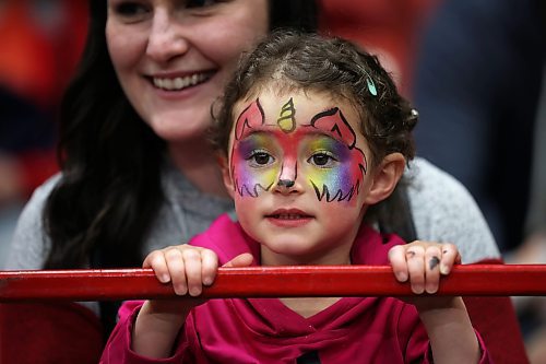 29032023
Two-year-old Gemma Lesage watches the WoofJocks Canine All Stars' perform along with her mother Ashley during the Royal Manitoba Winter Fair at Westoba Place on Wednesday. 
(Tim Smith/The Brandon Sun)
