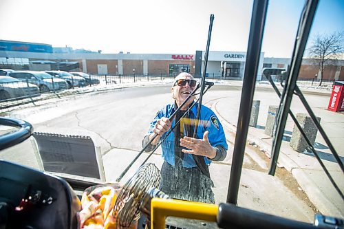 MIKAELA MACKENZIE / WINNIPEG FREE PRESS

Transit operator Joseph Fullmer checks his bus before taking off from the Garden City Shopping Centre bus loop in Winnipeg on Thursday, March 23, 2023. For Dave story.

Winnipeg Free Press 2023.