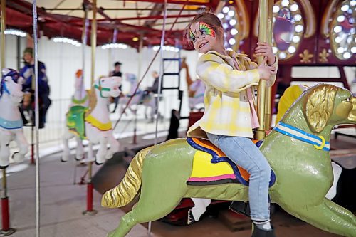 Prynely Hannay, 5, rides a carousel during the Royal Manitoba Winter Fair at the Keystone Centre on March 30. (Tim Smith/The Brandon Sun)
