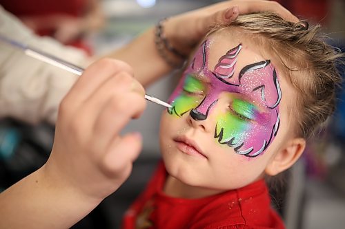 Isabella Camart, 5, has her face painted during the Royal Manitoba Winter Fair at the Keystone Centre on March 30. (Tim Smith/The Brandon Sun)
