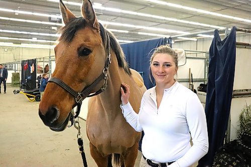 Kassidy Zrudlo poses for a photo with her horse Molly Thursday morning Westoba Credit Union Agricultural Centre of Excellence. The pair travelled all the way from Rhein, Sask. to take part in this year's Royal Manitoba Winter Fair horse show. (Kyle Darbyson/The Brandon Sun)