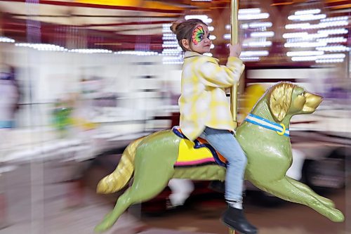 30032023
Five-year-old Prynely Hannay rides a carousel during the Royal Manitoba Winter Fair at The Keystone Centre on Thursday. 
(Tim Smith/The Brandon Sun)
