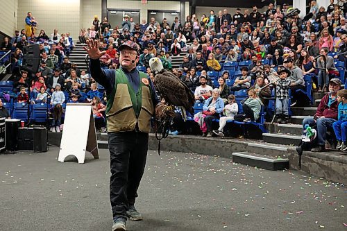 30032023
James Cowan, one of the directors of the Canadian Raptor Conservancy, shows a bald eagle to a large crowd of raptor enthusiasts during the Royal Manitoba Winter Fair at The Keystone Centre on Thursday. 
(Tim Smith/The Brandon Sun)
