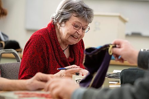 Mike Sudoma/Winnipeg Free Press
Julianna Kading smiles while writing down her new score after making a move during a weekly Winnipeg Scrabble Club meetup at the Canadian Mennonite University Thursday evening
March 30, 2023 