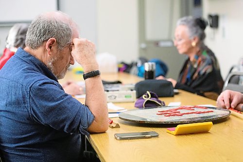 Mike Sudoma/Winnipeg Free Press
Murray Goldberg thinks before making a move during a weekly Winnipeg Scrabble Club meetup at the Canadian Mennonite University Thursday evening
March 30, 2023 