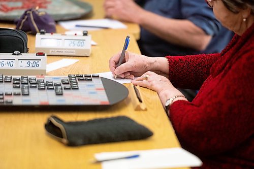 Mike Sudoma/Winnipeg Free Press
Julianna Kading writes down her new score after making a move during a weekly Winnipeg Scrabble Club meetup at the Canadian Mennonite University Thursday evening
March 30, 2023 