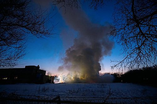 Mike Sudoma/Winnipeg Free Press
A large cloud of black smoke rises from a large warehouse fire on Sutherland Avenue Thursday evening
March 30, 2023