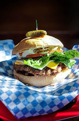 RUTH BONNEVILLE / WINNIPEG FREE PRESS 
Golden Boy Bistro’s menu currently boasts wings, salads, smokies and a Golden Boy burger, which features a beef or chicken patty slathered with cheese, chili, bacon and a secret sauce. 