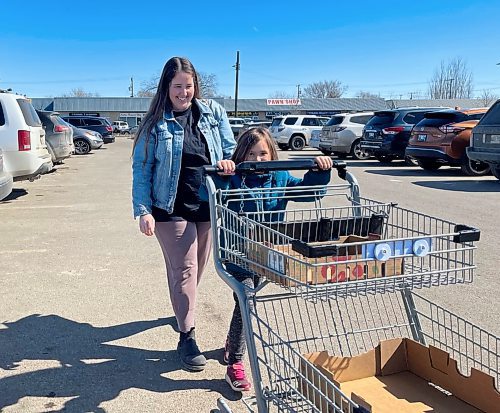 Kali Shakel and her seven year old daughter Blakely head into Brandon's Real Canadian Superstore for grocery shopping. (Michele McDougall/Brandon Sun)  