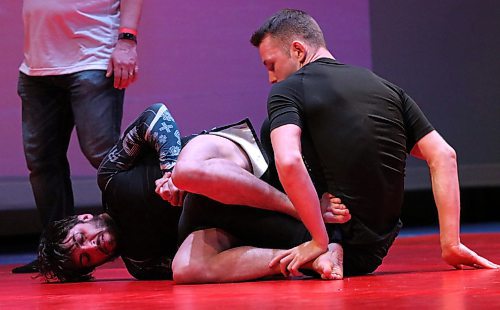 Aidan St. Laurent of Shilo works on the leg of Allan McDonald of Winnipeg. St. Laurent dominated much of the match and won it with a submission in overtime. (Perry Bergson/The Brandon Sun)