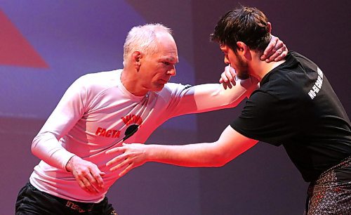 Event organizer Chris Kading gets a hold of Brady Duggan during their quintet team match. The pair fought to a draw and both were eliminated. (Perry Bergson/The Brandon Sun)