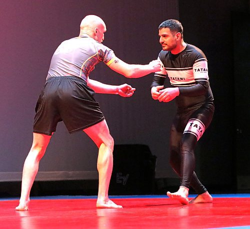 Sahba Zehtab-Jadid of Brandon tries to get a grip on Ryan Rajczakowski of Winnipeg. Zehtab-Jadid spent much of the six-minute fight on his back but pulled out a victory in overtime. (Perry Bergson/The Brandon Sun)
