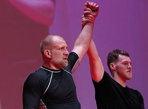 Joe Doerksen has his arm raised in victory after defeating Logan McDonald of Kenora with a late armbar in their 10-minute match at Brandon Bouts at Western Manitoba Centennial Auditorium on Saturday. (Perry Bergson/The Brandon Sun)