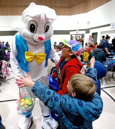 JOHN WOODS / WINNIPEG FREE PRESS
Hunter Peabody, foreground, and his brother Aiden reach out for a hug from a person dressed as a bunny at the Bunny Bash Eggstravaganza in the Glenlawn Community Centre Sunday, April 2, 2023. Activities at the inaugural event included a scavenger hunt, a bouncy castle, arts and crafts, and skating with the bunny.

Re: ?