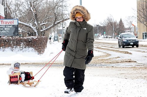 03042023
Two-year-old Lua Beaulieu is pulled through fresh snow in a sleigh by her mother Carmel Razzaghi on a Monday.
(Tim Smith/The Brandon Sun)