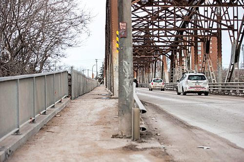 MIKAELA MACKENZIE / WINNIPEG FREE PRESS

The Louise Bridge sidewalk in Winnipeg on Monday, April 3, 2023. A general contractor is suing the city after he significantly injured his leg and foot after it was caught in a hole in the sidewalk of the Louise Bridge. He alleges the city didn&#x2019;t put up a sign, barricade the area or properly maintain the bridge sidewalk, causing him lost income after he fractured two bones. For Erik story.

Winnipeg Free Press 2023.