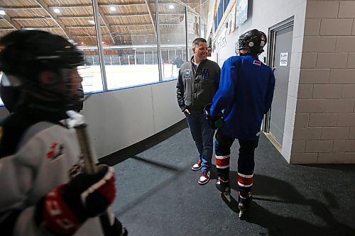 JOHN WOODS / WINNIPEG FREE PRESS
Hockey dad and former Winnipeg mayor Brian Bowman talks to his son as he comes off the ice from his hockey practice at River Heights C.C. Monday, April 3, 2023. 

Re: