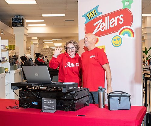 JESSICA LEE / WINNIPEG FREE PRESS

Zellers GM Ewa Turski waves while standing next to DJ Dave Filiatrault at the newly re-opened Zellers, on the second floor of Hudson&#x2019;s Bay at St. Vital Mall on April 4, 2023. Today is the first day of it&#x2019;s re-opening. 

Reporter: Gabby Piche
