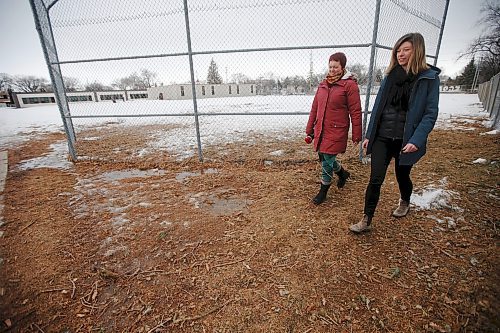 JOHN WOODS / WINNIPEG FREE PRESS
Meghan Cameron, right, and Miranda Hood, whose children are students at Sir William Osler school are photographed at the school Tuesday, April 4, 2023. The parents are disappointed that the expansion of the school will result in green space and baseball fields being removed for a parking lot and pickup/drop off loop.

Re: macintosh