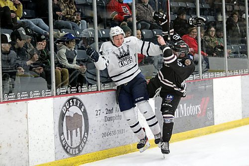 Dauphin Kings forward Logan Walker, left, is slammed into the boards by Swan Valley Stampeders defenceman Owen Harris during a Manitoba Junior Hockey League playoff game at Credit Union Place on Saturday night. Harris, who started the season with the Brandon Wheat Kings, is from Wawanesa. (Lucas Punkari/The Brandon Sun)