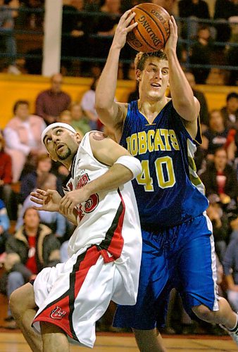 Bobcats' Adam Hartman, right keeps the ball from his former provincial team guard Erfan Nasajpour of the Winnipeg Wesmen during a game in 2006. (Brandon Sun files)