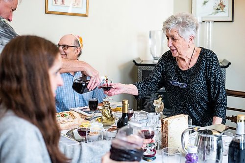 MIKAELA MACKENZIE / WINNIPEG FREE PRESS

Holocaust survivor Betty Kirshner gets her wine glass filled before starting songs and readings at a Seder dinner marking the start of Passover in the Chodirker household in Winnipeg on Wednesday, April 5, 2023. Standup.

Winnipeg Free Press 2023.