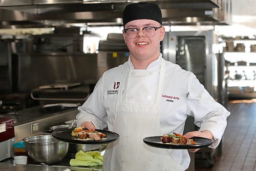 First-year Assiniboine Community College culinary student Jaxon Durgan showcases his pork entrée during this year's Manitoba Pork Black Box Competition, which took place at the North Hill campus on Thursday. (Kyle Darbyson/The Brandon Sun) 