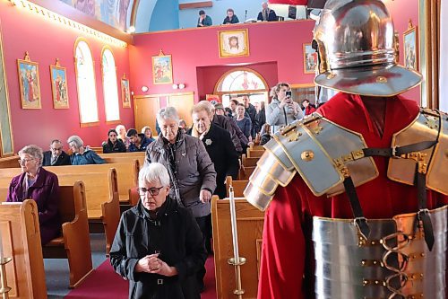 St. Mary's Ukrainian Catholic Church parishioners honour the holy shroud during Good Friday service in Brandon as Roman centurions look on. To commemorate the crucifixion and resurrection of Jesus Christ, St. Mary’s parishioners took turns guarding the church’s holy shroud in one-hour blocks throughout Friday and Saturday. (Kyle Darbyson/The Brandon Sun)