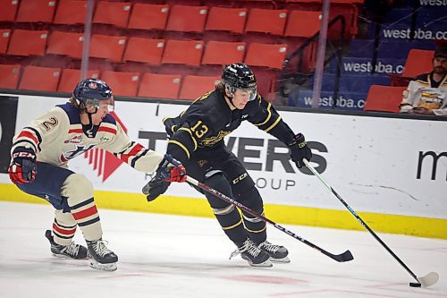 Brandon Wheat Kings rookie Roger McQueen (13) showed flashes of the player he can be but has to grow into that big frame. (Tim Smith/The Brandon Sun)