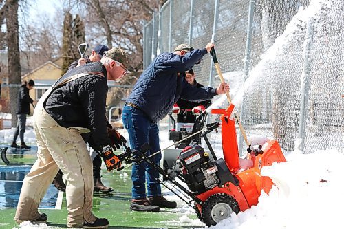 Members of the Brandon Pickleball Club clean up the pickleball courts located at Stanley Park during a mild Easter Sunday afternoon in Westman. (Kyle Darbyson/The Brandon Sun)