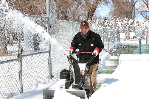 Members of the Brandon Pickleball Club clean up the pickleball courts located at Stanley Park during a mild Easter Sunday afternoon in Westman. (Kyle Darbyson/The Brandon Sun)