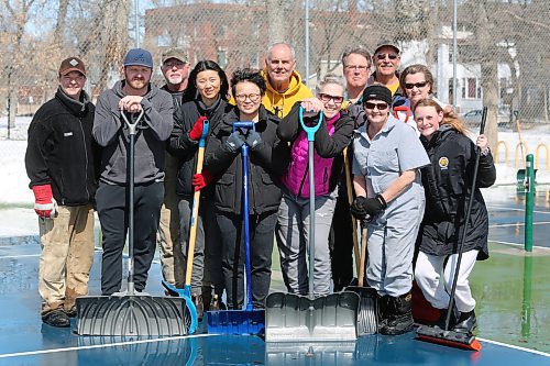 Members of the Brandon Pickleball Club clean up the pickleball courts located at Stanley Park during a mild Easter Sunday afternoon in Westman. (Kyle Darbyson/The Brandon Sun)