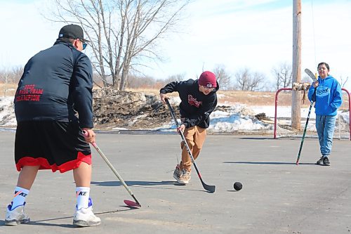 Dryden Gage, Nash Ironman and Douglas Hanska enjoy a game of ball hockey during Sioux Valley Dakota Nation's Spring Carnival celebration, which took place throughout Monday morning and afternoon. This event invited members of this Indigenous community to take part in a variety of activities, including volleyball, the moccasin game and a snow sculpture contest. (Kyle Darbyson/The Brandon Sun)