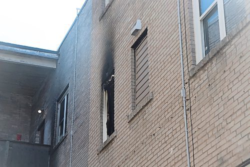 Public health inspectors have deemed three of the suites inside Adanac Apartments at 737 Sargent Ave. "unlivable" after they were damaged in fires. Scorched bricks mark where one such apartment was damaged. Pictured April 11, 2023. (Tyler Searle / Winnipeg Free Press) 